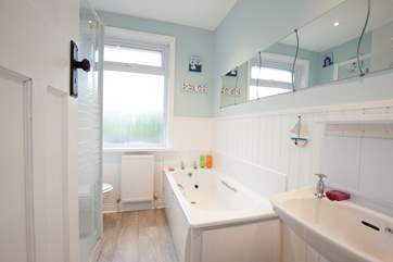 The family bathroom offers both a bath and separate shower.