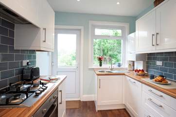 The kitchen leads out to a lovely decked patio-area at the rear of the cottage.
