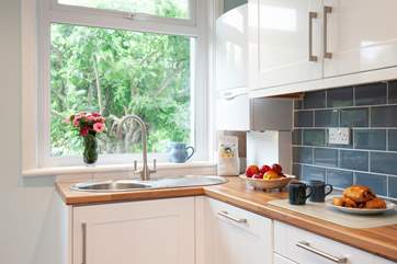 The bright, modern kitchen is especially pleasant.