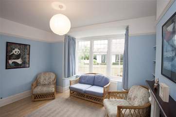 The family room is an alternative retreat from the living room