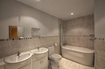 En suite bathroom with spa bath.