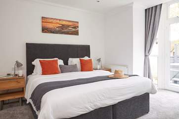 The super-king size bed in the family bedroom with en suite bathroom.