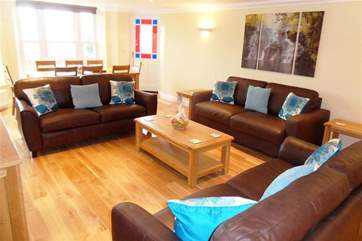 There is lovely soft seating in the sitting/dining-room.