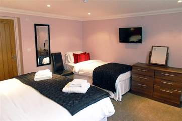 This bedroom has a super-king double and a single bed.