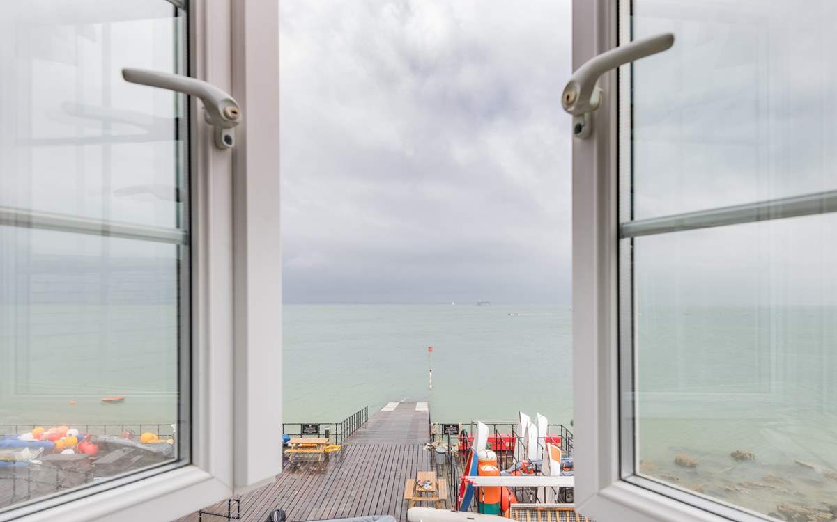 A bedroom with a stunning view, watch the sailing world go by