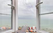 A bedroom with a stunning view, watch the sailing world go by