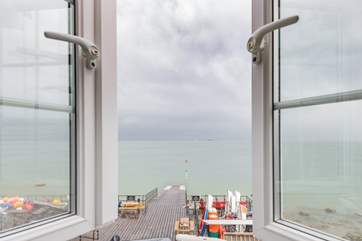 A bedroom with a stunning view, watch the sailing world go by