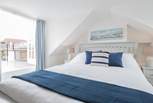 The master bedroom on the second floor has access to a spacious roof terrace to the rear of the property - it is in the eaves so has restricted head height