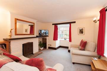 There is ample seating for everybody in the snug sitting-room.