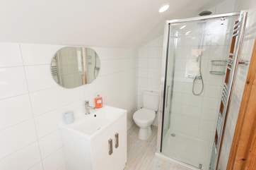 Both bathrooms provide a bit of modern luxury in this country cottage.