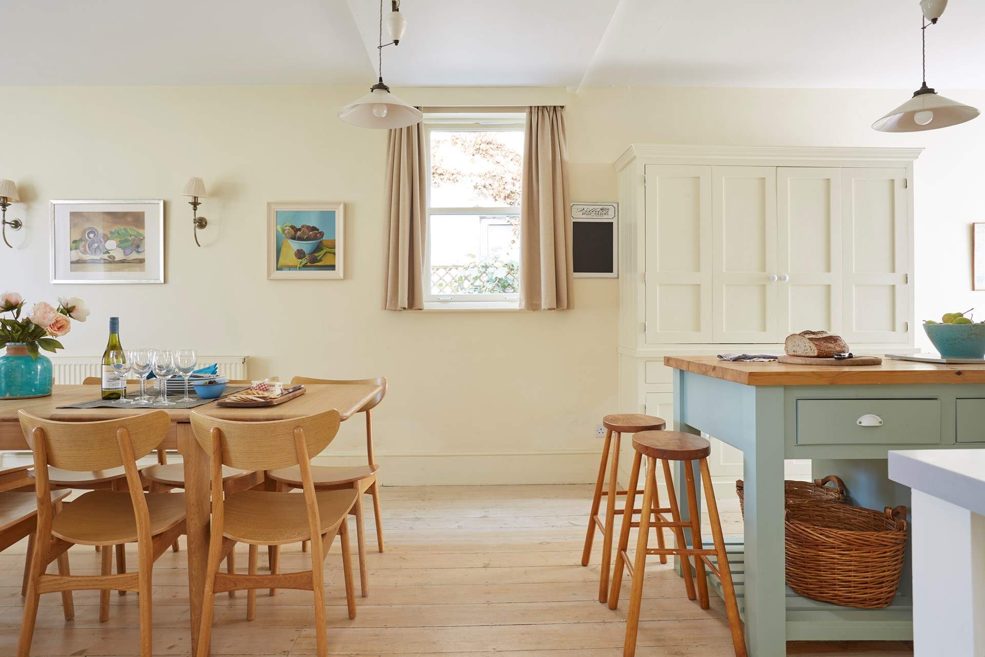 Light and airy kitchen with stylish dining-table and chairs.