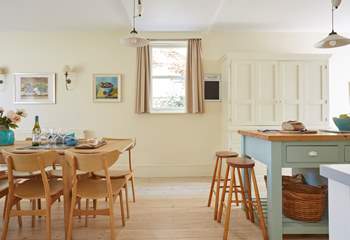 Light and airy kitchen with stylish dining-table and chairs.