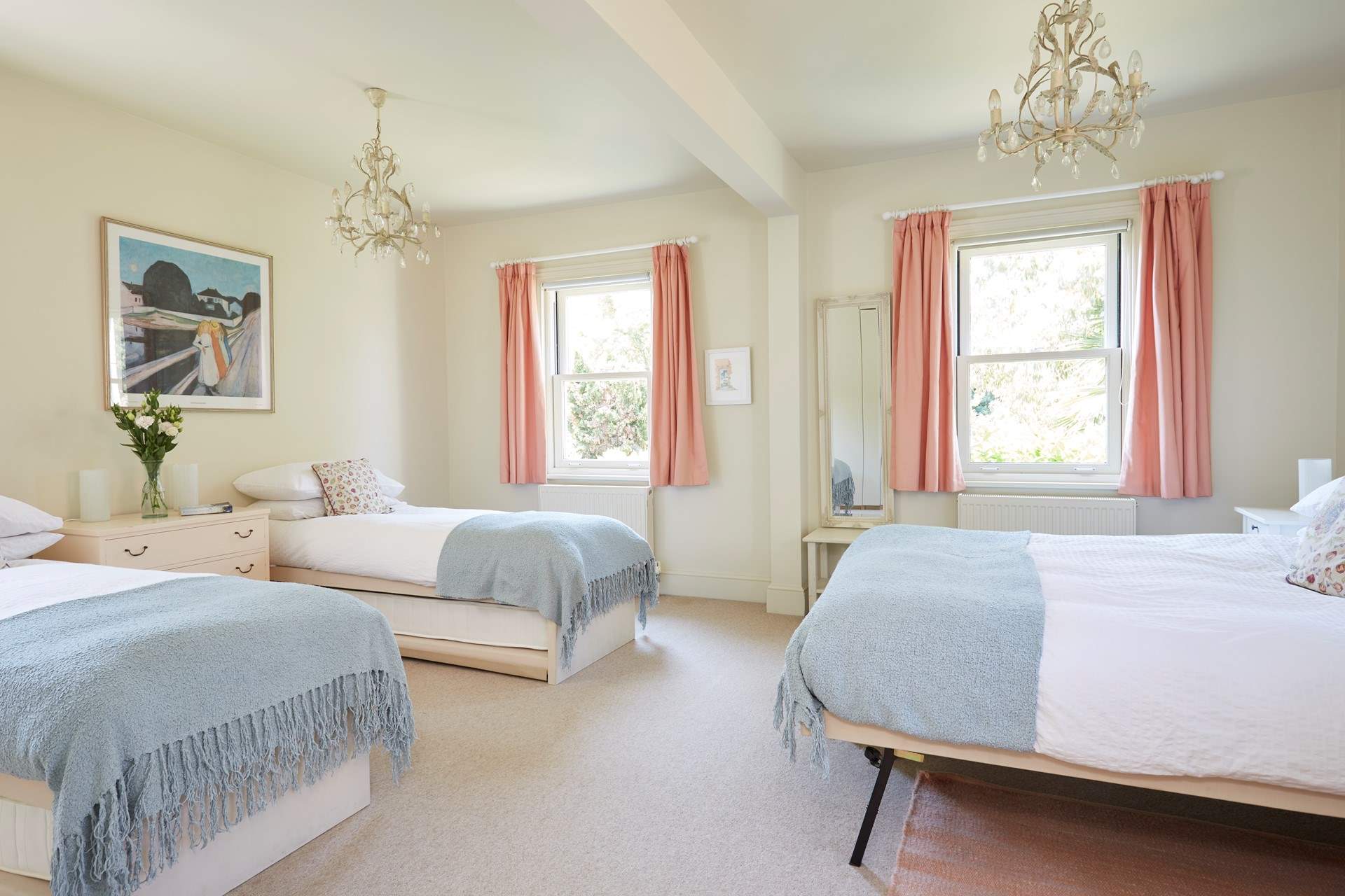 The large family bedroom with twin beds and a king-size bed, ideal for a young family.