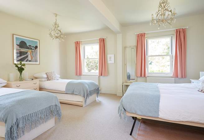 The large family bedroom with twin beds and a king-size bed, ideal for a young family.