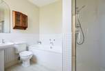 The en suite bathroom with separate shower and bath to the triple bedroom.