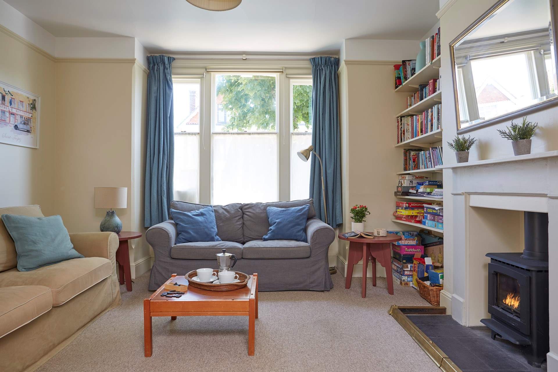The family room with comfortable sofas and a wood-burner effect gas stove.