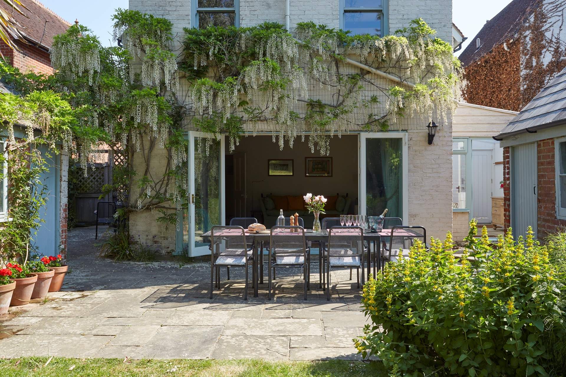 The gorgeous wisteria drapes the back of Orchard House when in bloom.