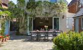 The gorgeous wisteria drapes the back of Orchard House when in bloom. - Thumbnail Image