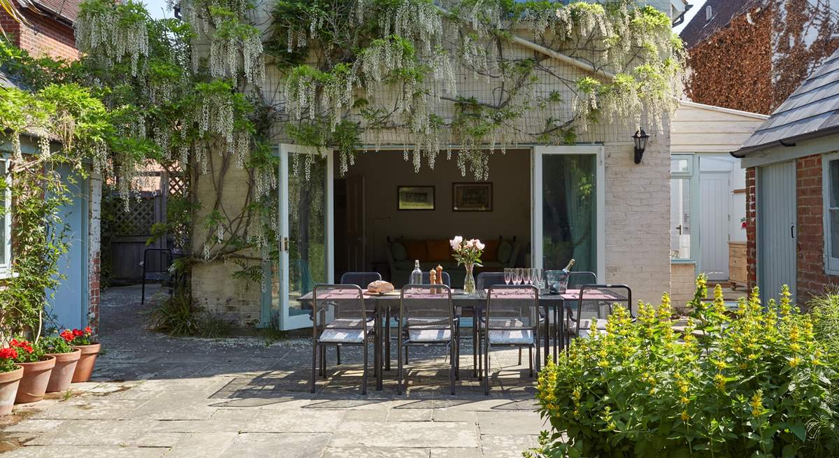 The gorgeous wisteria drapes the back of Orchard House when in bloom.