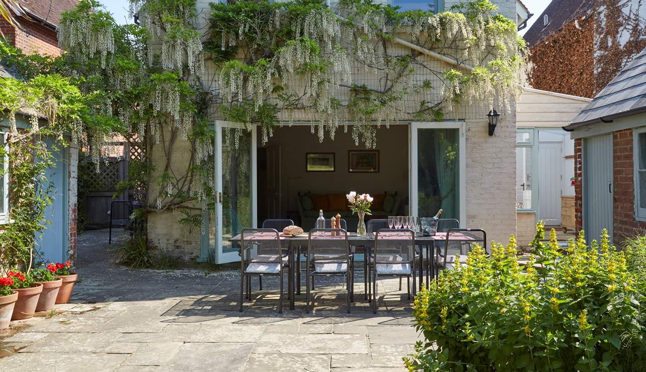 The gorgeous wisteria drapes the back of Orchard House when in bloom.