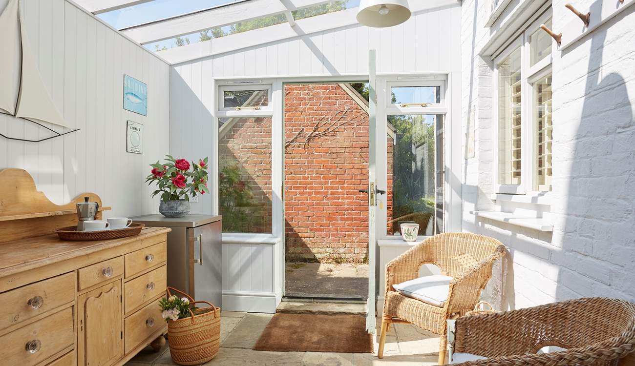 The sun-room is ideal to hang your beach towels on the pegs or read a good book in the sun.