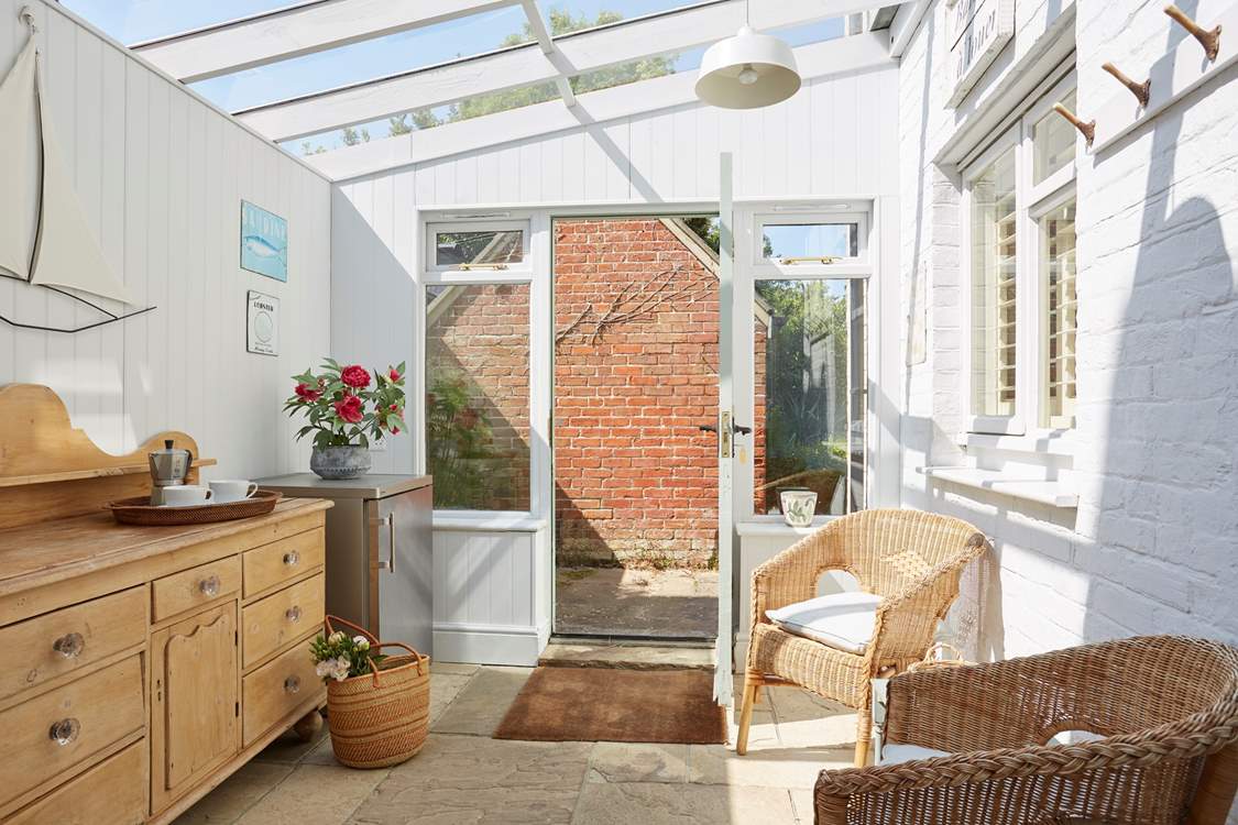 The sun-room is ideal to hang your beach towels on the pegs or read a good book in the sun.