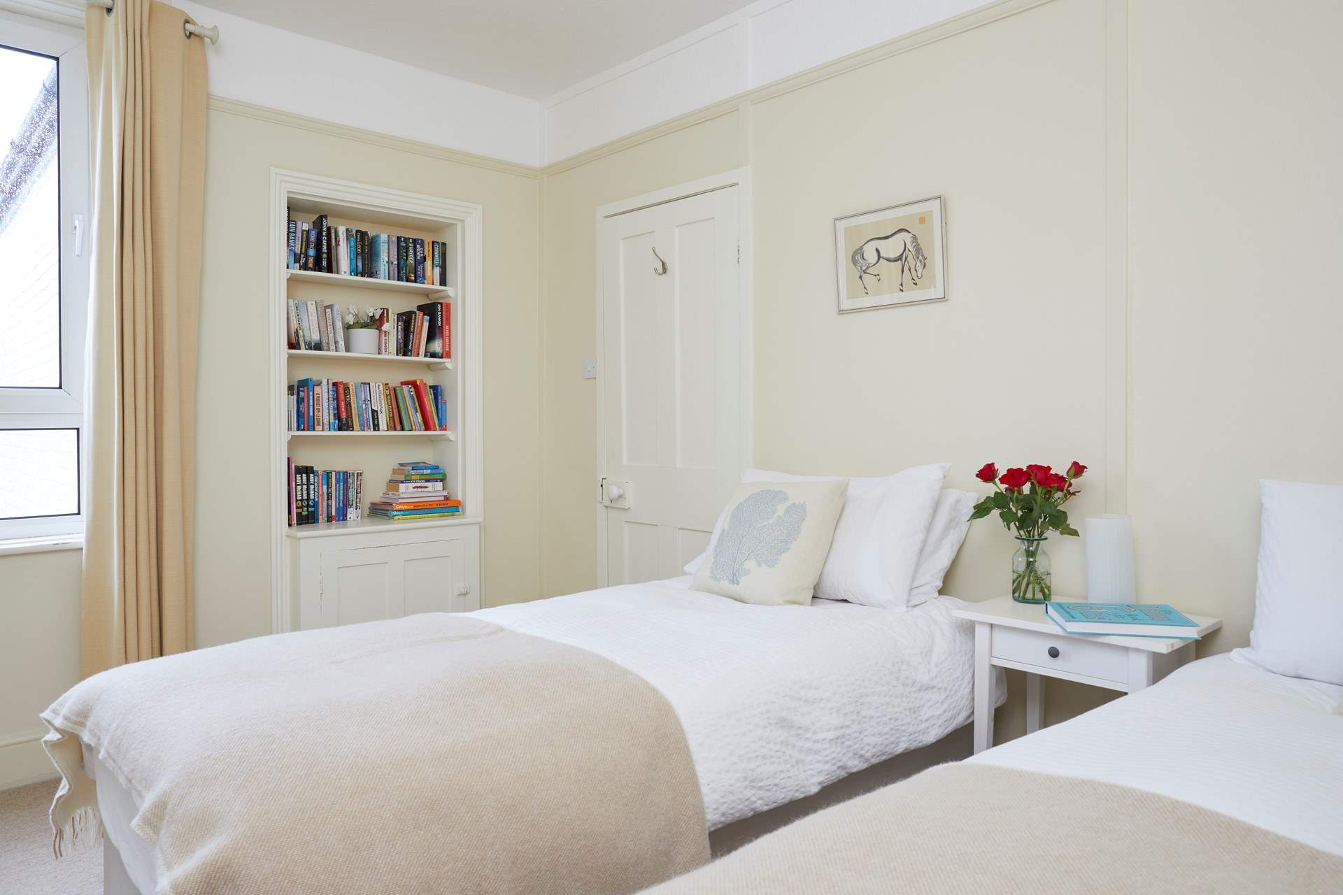 The twin bedroom faces the rear of the house.