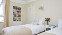 The twin bedroom faces the rear of the house.