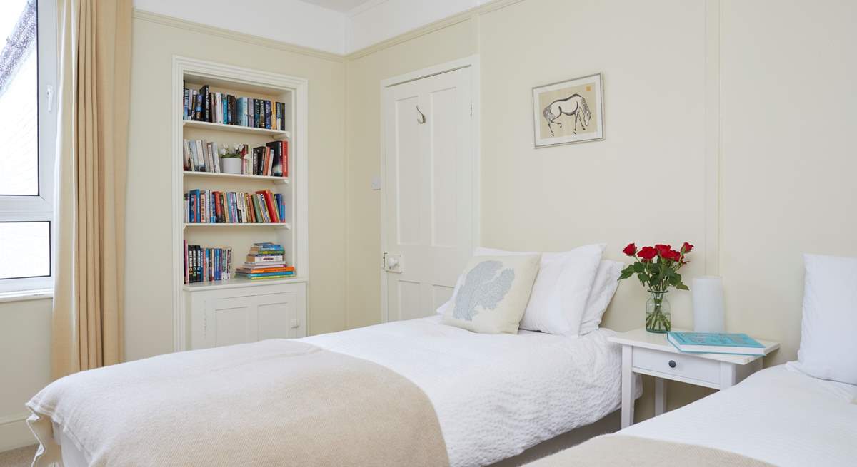 The twin bedroom faces the rear of the house.