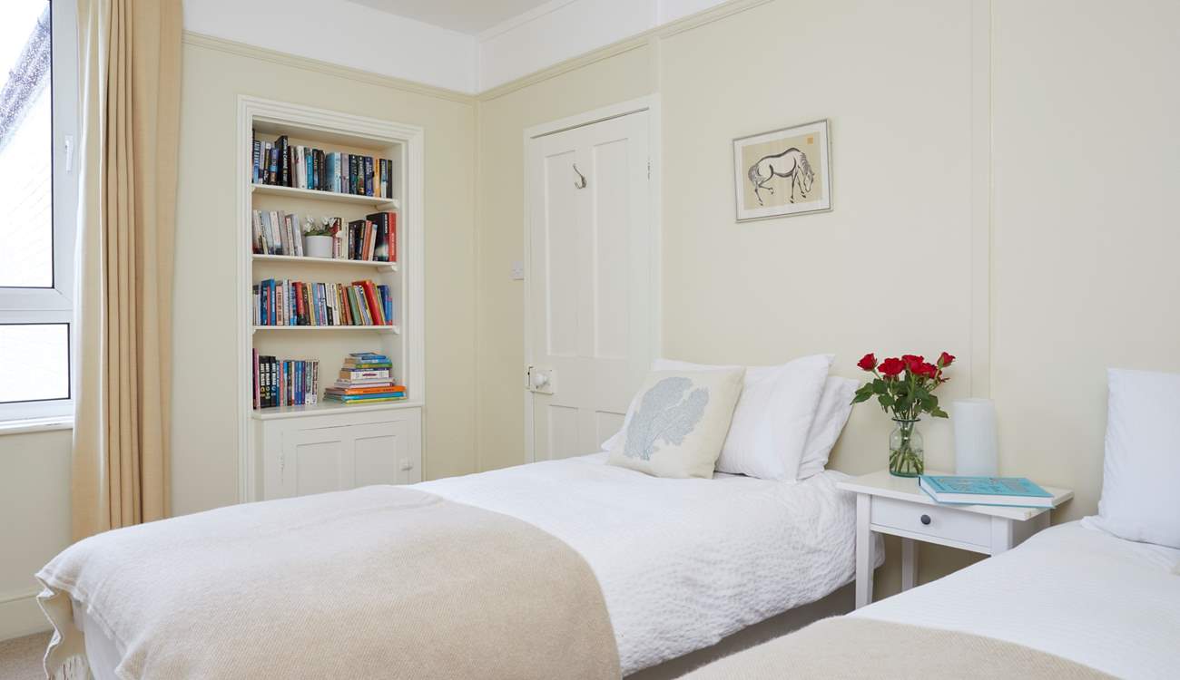 The twin bedroom faces the rear of the house.