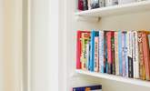 There are plenty of books to choose from in the twin bedroom.  - Thumbnail Image