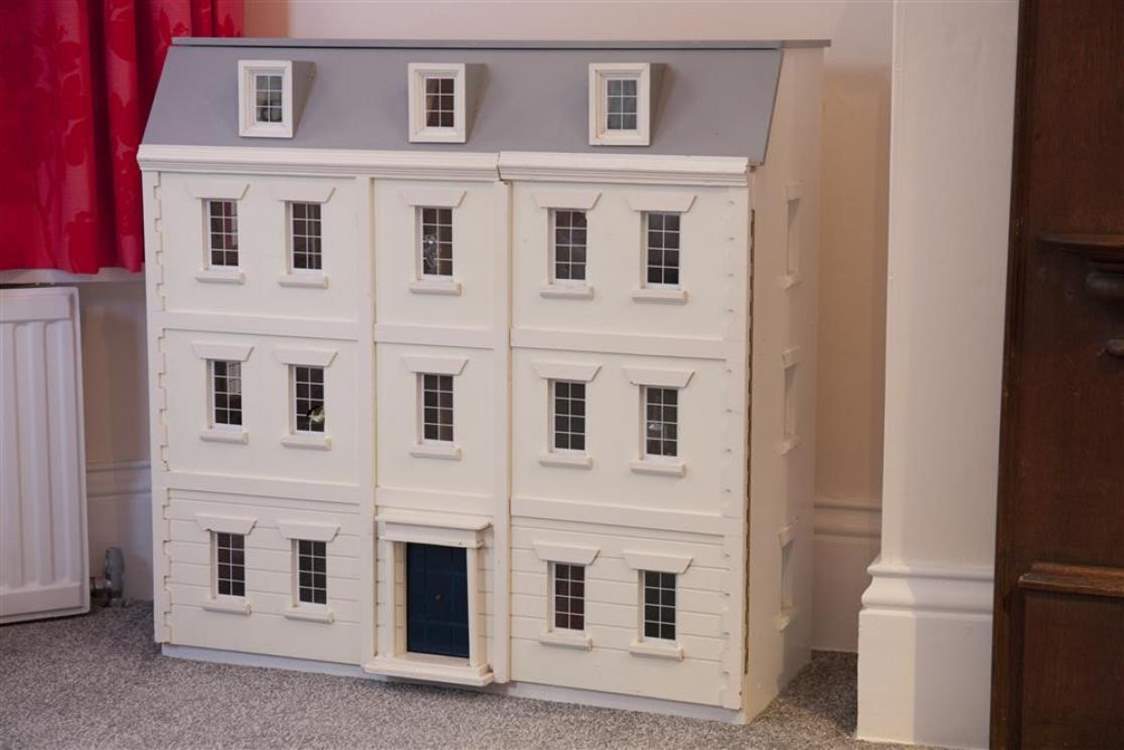 The adorable doll house in the twin bedroom.