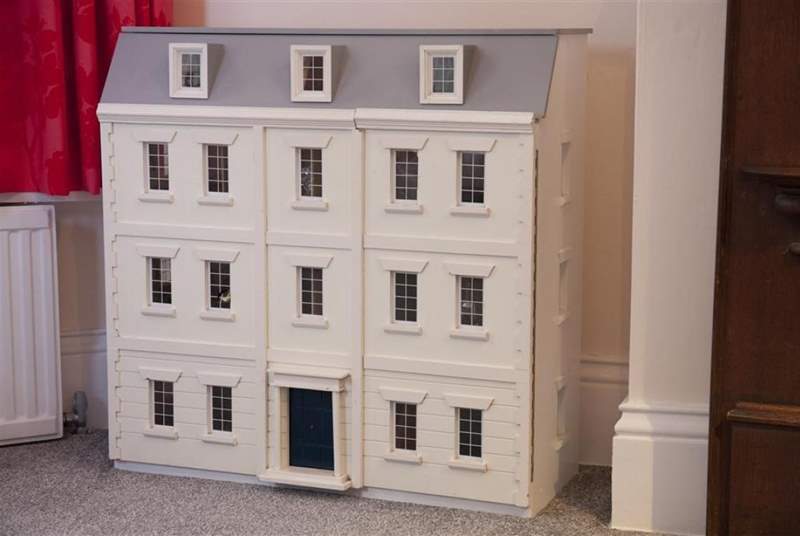 The adorable doll house in the twin bedroom.