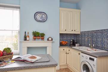 The bright and airy kitchen with all the modern appliances.