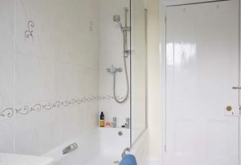 The family bathroom with view of the shower overhead.