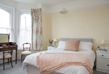 The large and comfortable main bedroom with sea views.