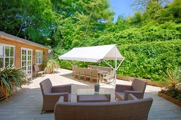 The outside seating area is a beautiful spot to enjoy the warm summer days.