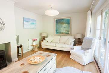 The second living-room is beautiful, with wood-burning stove for the colder days and bi-folding patio doors out to the garden for the warmer ones.