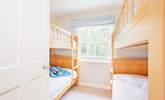 The twin bunk beds accommodate four, ideal for the children in your party. - Thumbnail Image