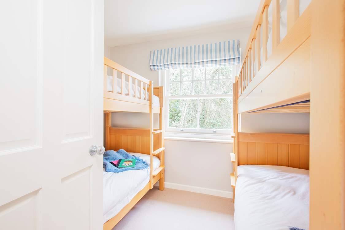 The twin bunk beds accommodate four, ideal for the children in your party.