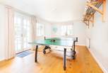 Play a game of ping pong in the games-room - best of three?