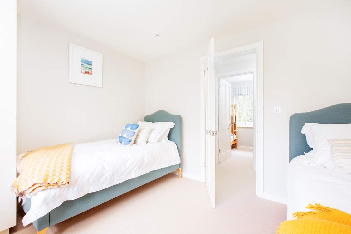 Bedroom three with comfortable twin beds and the twin bunk room across the hall.