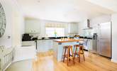 The sytlish kitchen with island and breakfast bar is an ideal space to prepare your favourite meals. - Thumbnail Image