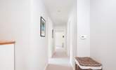 The upstairs hallway leading to the three further bedrooms. - Thumbnail Image