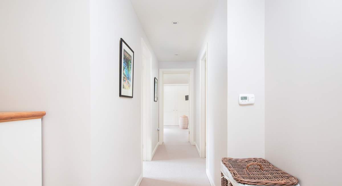 The upstairs hallway leading to the three further bedrooms.