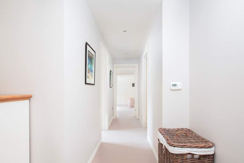 The upstairs hallway leading to the three further bedrooms.