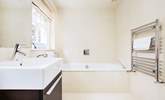 The family bathroom with a luxurious bath to soak in and relax. - Thumbnail Image