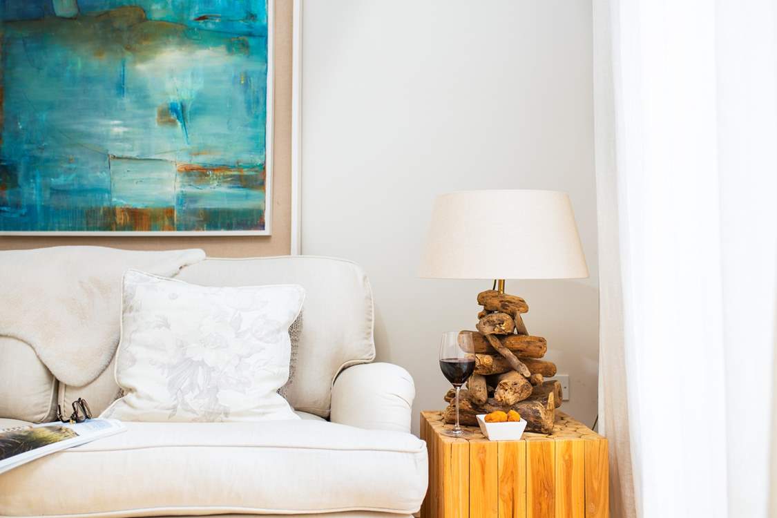 Enjoy a sip of wine and a good read on the relaxing sofa in the sitting-room.