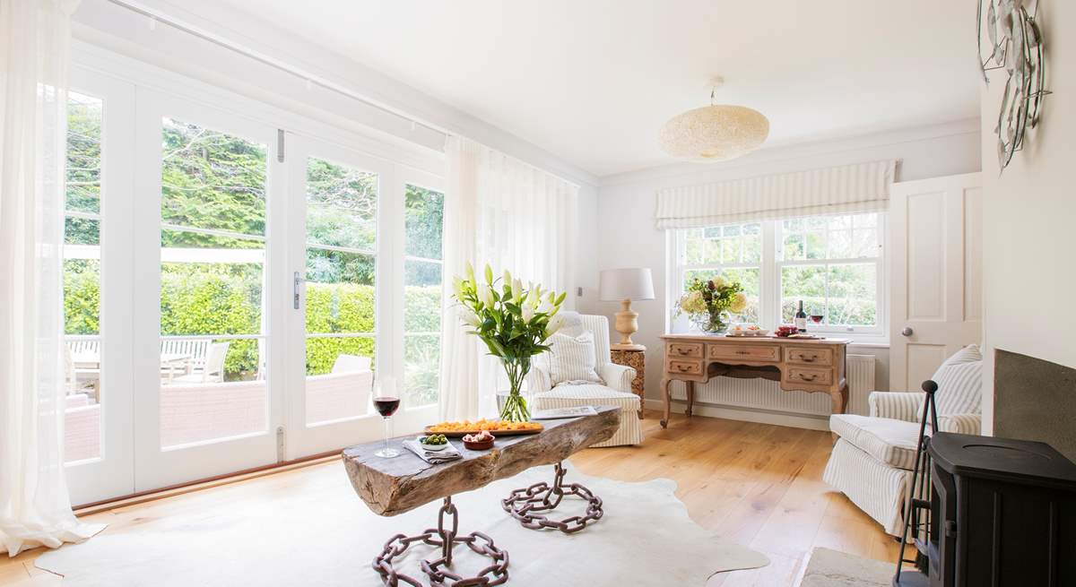 The second living-room is beautiful, with wood-burning stove for the colder days and bi-folding patio doors out to the garden for the warmer ones.