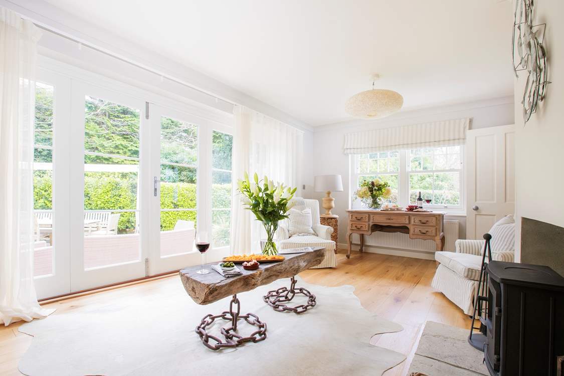 The second living-room is beautiful, with wood-burning stove for the colder days and bi-folding patio doors out to the garden for the warmer ones.
